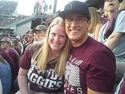 photo of katrina hofstetter and husband at aggie football game