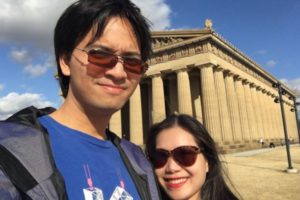 two people outside colosseum