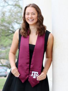 picture of Paige Ripberger wearing TAMU graduation stole