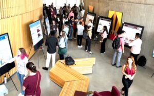 people presenting posters to guests