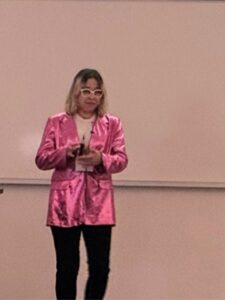 New Directory Photos (50) woman in pink jacket prresenting