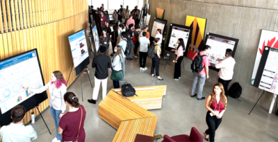 preople presenting posters to guests