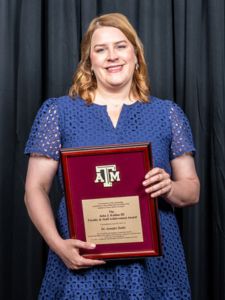 Jen Dulin holding John J. Koldus award