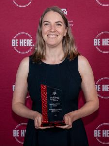 picture of McKensie Le Fevre holding award against maroon background