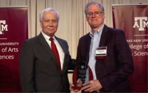 Mark Zoran and Wayne Versaw holding award together