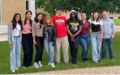 group of people posing outside