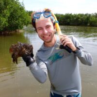 myles wagner holding creature with goggles